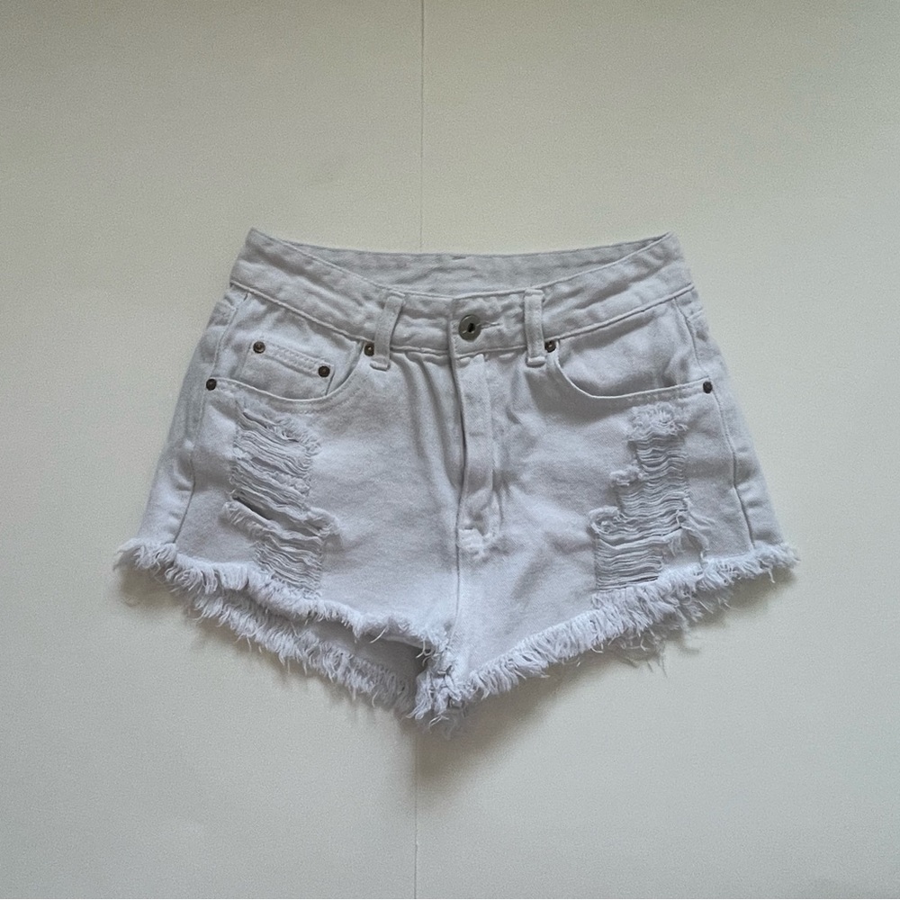 White high-waisted ripped jean shorts
